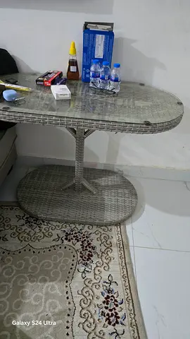 Round rattan glass-top bistro table - good condition