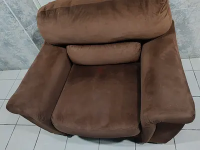 Brown single-seater suede armchair in good used condition