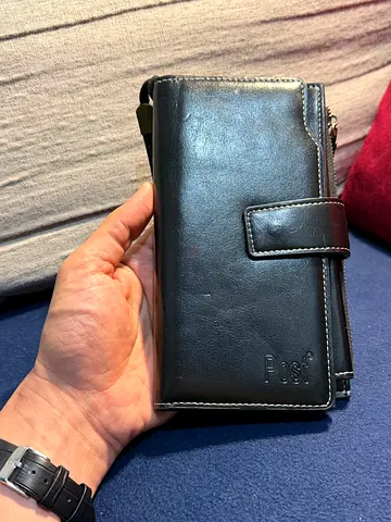 Used black leather long wallet with snap closure (holds cards & cash)