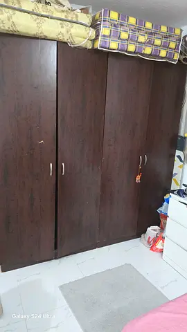 Dark brown 4-door wardrobe / armoire in good condition