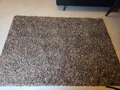 Brown shaggy area rug - good condition