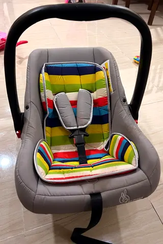 R for rabbit Grey infant car seat with colorful striped insert - good condition