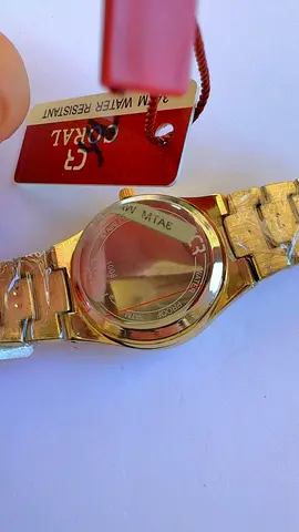 Coral gold-tone men's wristwatch, water resistant, new with tag