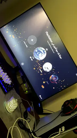 A complete gaming setup, including a monitor, microphone, magnetic keyboard, mouse, CD drive, mouse