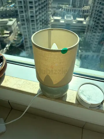 Small beige bedside table lamp with fabric shade