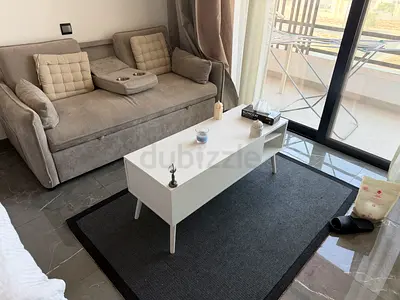Compact white coffee table with storage - good condition