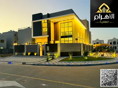 Villa for sale in Ajman | Al Helio 2 area | 4 bedrooms, a majlis, and 2 living rooms | Freehold for all nationalities | Price includes registration fe