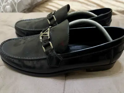 LV Black leather men's loafers with metal buckle, gently used
