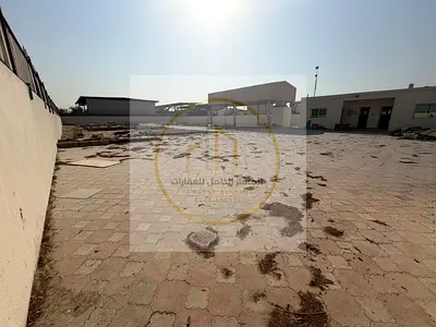 Industrial Yard for Rent in Al Sajaa, 20,000 Sq Ft with Interlock Flooring, Covered Shed, 32 kW Power and Office Facilities