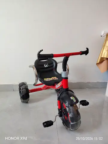 Red three-wheel kid's tricycle with seat - good condition