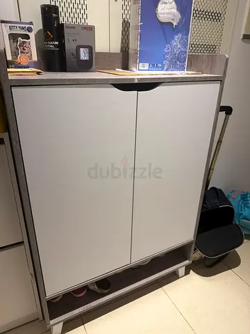 Compact two-door shoe cabinet / storage unit in light grey