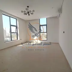 Luxurious brand-new corner townhouse for rent in Al Helio 1 Ajman featuring a spacious roof terraceI
