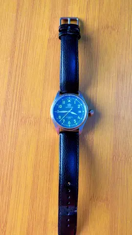 Classic men's analog wristwatch with black leather strap