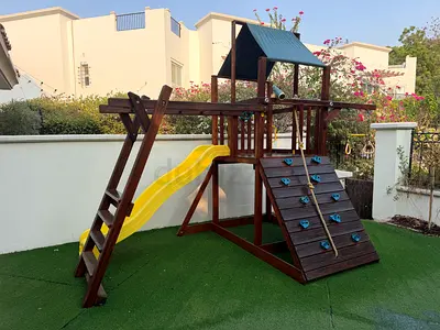 Child’s climbing frame with slide and monkey bars