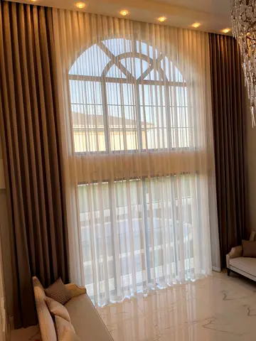 Full-height double-layer curtains with sheer and blackout panels (custom-fit)