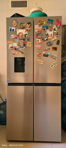 Stainless Steel 4-Door Refrigerator with Water Dispenser - Good Working Condition