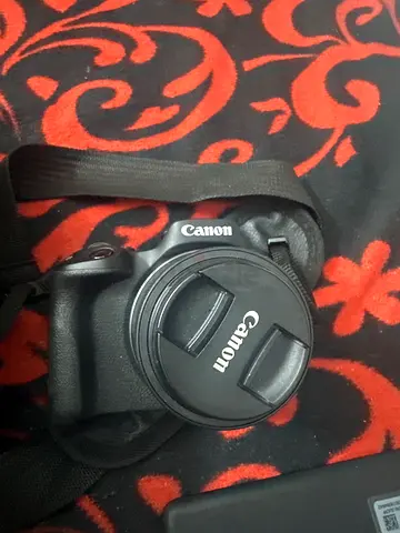 Canon DSLR with kit lens and strap - used, good condition