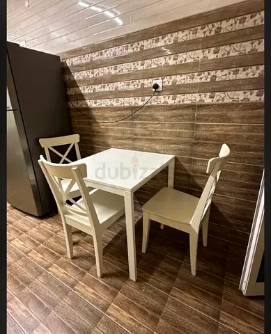 Compact dining table with 4 matching chairs