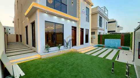 Luxury villa with a swimming pool for sale in Al Helio 1 – Ajman | 5 master bedrooms + rooftop | Pr