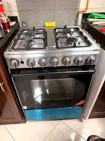 Midea freestanding gas cooker with oven - 4 burners, stainless steel