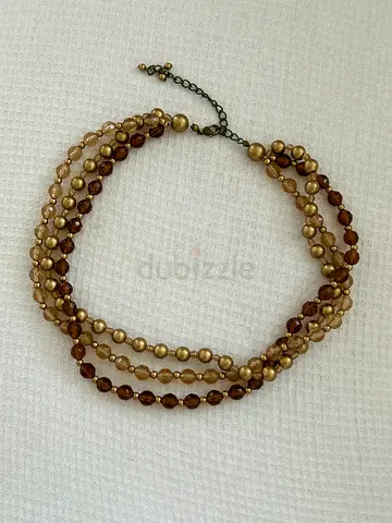 Multi-strand brown and gold beaded necklace