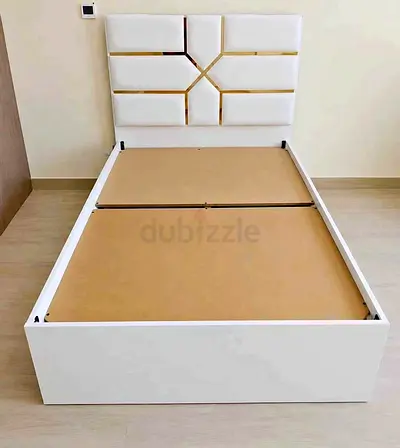 Single white platform bed with padded geometric headboard - good condition