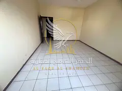 Apartment for rent in Maysaloon, Sharjah, featuring two rooms, a living area, two bathrooms, and a b