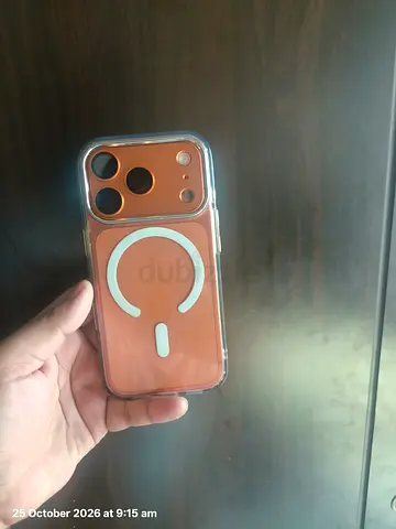 iPhone with clear MagSafe case and charger - good condition