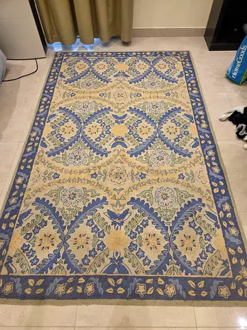 Used blue and beige patterned area rug — 2.5m x 1.5m (approx.)