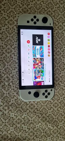 Nintendo Switch OLED with white Joy‑Con - good working condition