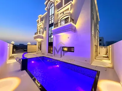 Luxury villa with pool for sale in Al Helio 2 – Ajman | 5 bedrooms + majlis + 2 living rooms + roof