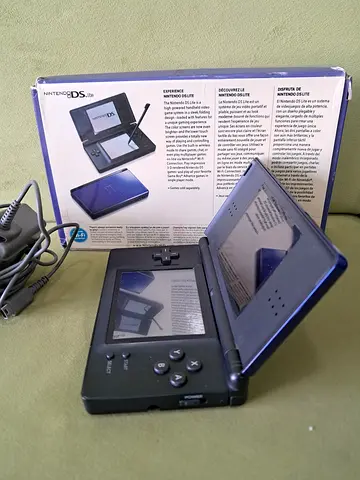 Nintendo DS Lite handheld console with charger and box - working condition