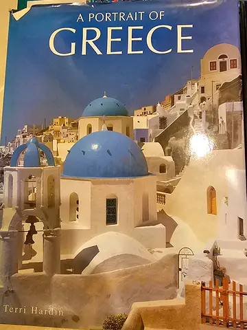 Set of travel and reference books including Greece, Saudi Arabia, Rotterdam, and images of Iran
