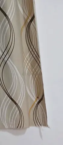 Beige wavy patterned curtain panel — gently used