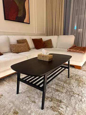 Black wooden coffee table with slatted shelf - good condition