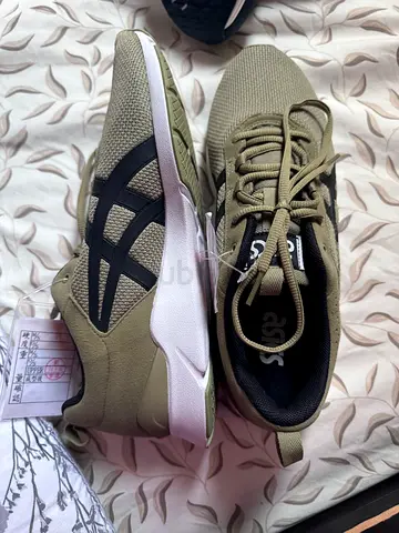 Olive green ASICS sneakers, gently used, size available