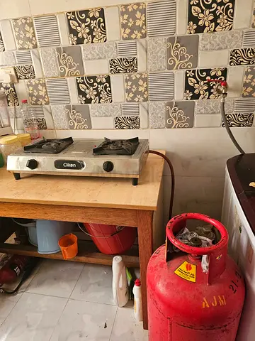Used Two-Burner Gas Stove with LPG Cylinder