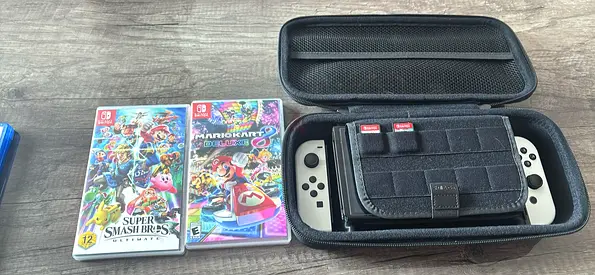 Nintendo Switch OLED with Carry Case + 2 Games (Mario Kart 8 + Smash Bros)
