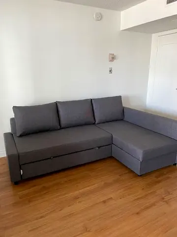 Grey L-shaped Sofa Bed with Storage - Good Condition