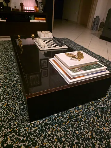 Dark wood coffee table with glass top and storage - average condition