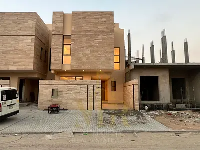 Villa for sale in Al Helio 2, featuring two floors and a roof terrace. Down payment of only 10%. Includes central air conditioning, utility connection
