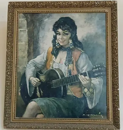 Framed vintage oil painting of a woman playing guitar