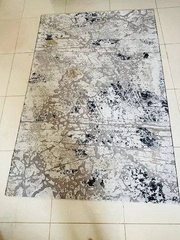 Gray abstract modern area rug — good condition for sale, used less.