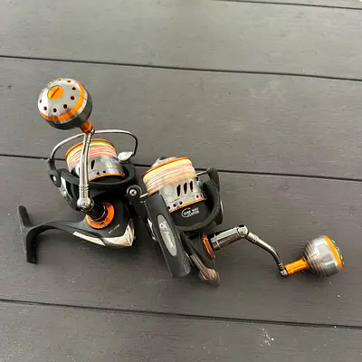 Two spinning fishing reels - used, good working condition