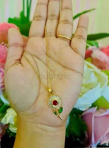 Gold-tone Sunflower Pendant Necklace with Red Center and Green Leaf