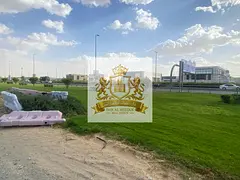 🏢 Commercial land for sale, located directly on Maleha Road in Al-Hoshi. Area: 6,000 square feet.