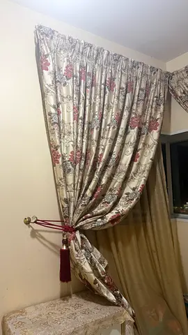 Pair of floral fabric curtains with tiebacks — good condition