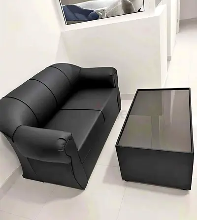 Black 2-Seater Sofa with Matching Glass-Top Coffee Table - Good Condition