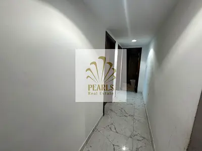 For annual rent in Oasis Towers, Al Rashidiya 1, Ajman. 2 bedrooms, separate living room, 2 bathroo