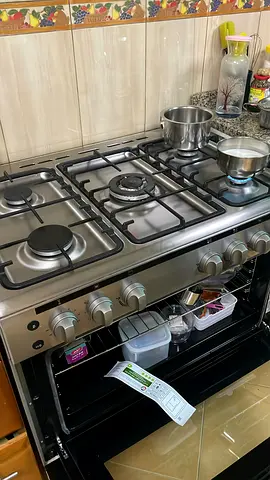 Stainless Steel 5-Burner Gas Stove with Oven - Excellent Condition. Under Warranty till Aug 2027